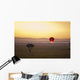 A Red Hot Air Balloon Takes Flight Against The Glowing Sky At Sunset Wall Mural