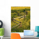 A Wooden Rail Fence Surrounded By Yellow Wildflowers Wall Mural