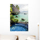 Jacuzzi and infinity pool over tropical ocean Wall Mural