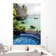 Jacuzzi and infinity pool over tropical ocean Wall Mural