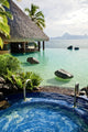 Jacuzzi and infinity pool over tropical ocean Wall Mural