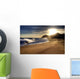 Wave on beach with sun shining. Wall Mural