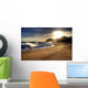 Wave on beach with sun shining. Wall Mural