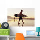 A Man Walking With His Surfboard On Valdevaqueros Beach Wall Mural