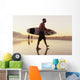 A Man Walking With His Surfboard On Valdevaqueros Beach Wall Mural
