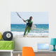 A Woman With Her Kitesurfing Board Walking Into The Water Wall Mural