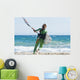 A Woman With Her Kitesurfing Board Walking Into The Water Wall Mural