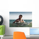 A Man With His Surfboard In The Water Wall Mural