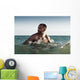 A Man With His Surfboard In The Water Wall Mural