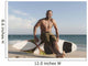 A Man Sits On His Surfboard On The Beach Wall Mural