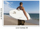A Man Standing On The Beach Holding His Surfboard Wall Mural