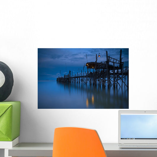 A Wooden Pier With Lights On It At Night Wall Mural