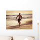 A Man Runs On The Wet Beach At Sunset With His Surfboard Wall Mural