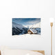 winterscene of alpine valley with snow coverd cabin Wall Mural