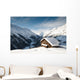 winterscene of alpine valley with snow coverd cabin Wall Mural