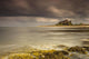 Bamburgh Castle Under A Cloudy Sky Wall Mural