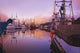 Sunrise Through The Morning Fog And Fishing Boats In Newport Harbor Wall Mural