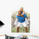 Senior Couple Exercising In Park Wall Mural