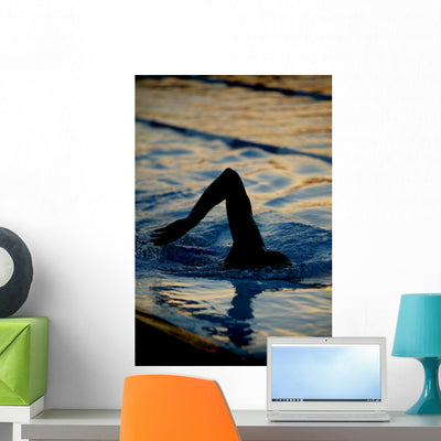Silhouetted Swimmer Wall Mural shown on a wall