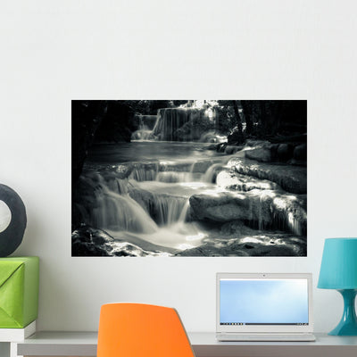 Multiple Waterfall Scene Black Wall Mural shown on a wall