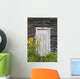 Door To An Old Shed With Wildflowers Growing Outside Wall Mural