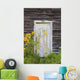 Door To An Old Shed With Wildflowers Growing Outside Wall Mural