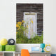 Door To An Old Shed With Wildflowers Growing Outside Wall Mural