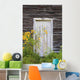 Door To An Old Shed With Wildflowers Growing Outside Wall Mural