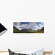 A Mountainous Landscape Under Clouds Wall Mural