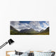 A Mountainous Landscape Under Clouds Wall Mural
