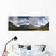 A Mountainous Landscape Under Clouds Wall Mural