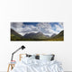 A Mountainous Landscape Under Clouds Wall Mural
