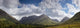 A Mountainous Landscape Under Clouds Wall Mural