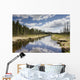 Clouds Reflected In A Tranquil River Lined With Trees Wall Mural