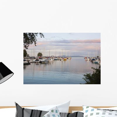 Boats Harbour Sunset Wall Mural shown on a wall