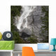 Water Cascading Down The Rock And Forming A Mist Wall Mural