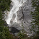 Water Cascading Down The Rock And Forming A Mist Wall Mural