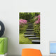 Rock Stairway Along A Moss Covered Hill With Flowering Bushes Wall Mural