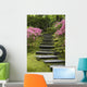 Rock Stairway Along A Moss Covered Hill With Flowering Bushes Wall Mural