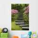 Rock Stairway Along A Moss Covered Hill With Flowering Bushes Wall Mural