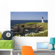 White Lighthouse On The Ocean With Blue Sky And Wildflowers Wall Mural