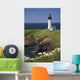 White Lighthouse On The Ocean With Blue Sky And Wildflowers Wall Mural