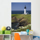 White Lighthouse On The Ocean With Blue Sky And Wildflowers Wall Mural