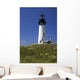 White Lighthouse With A Blue Sky And Wildflowers Wall Mural
