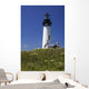 White Lighthouse With A Blue Sky And Wildflowers Wall Mural