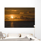 Sun Setting On The Ocean With The Sunlight Reflecting On The Water Wall Mural