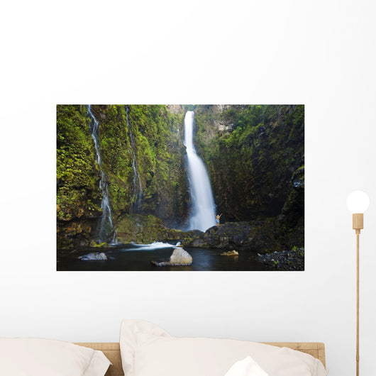 Hawaii, Maui, Nahiku, Woman Standing At Base Of Hanawi Falls Wall Mural