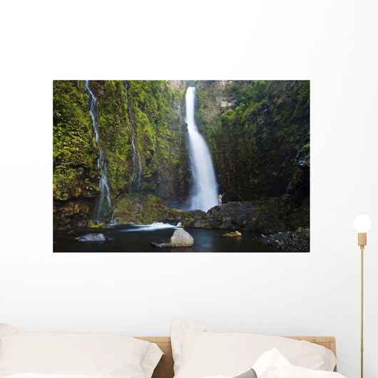 Hawaii, Maui, Nahiku, Woman Standing At Base Of Hanawi Falls Wall Mural