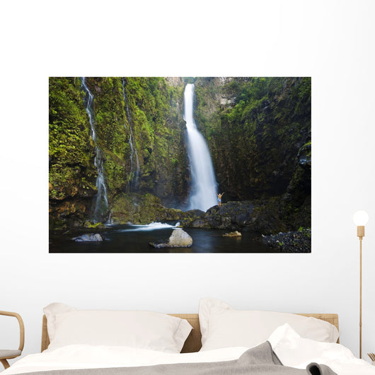 Hawaii, Maui, Nahiku, Woman Standing At Base Of Hanawi Falls Wall Mural