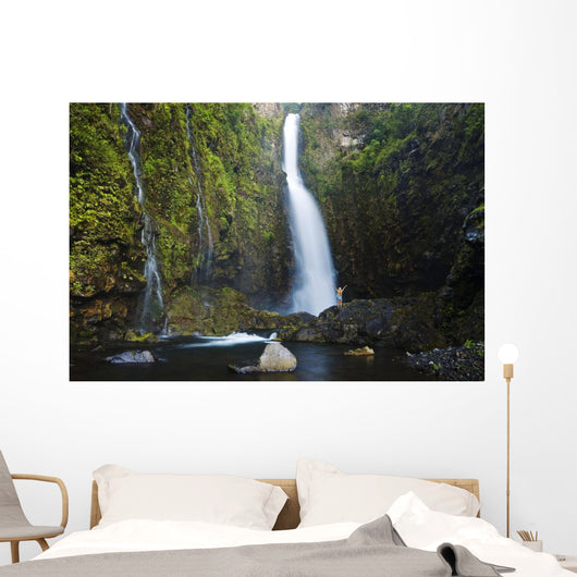 Hawaii, Maui, Nahiku, Woman Standing At Base Of Hanawi Falls Wall Mural